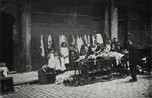 Cobble Stones Prints: Old clothes stall, East End of London