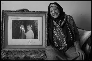 Old Egyptian lady with her wedding photp Cairo, Egypt