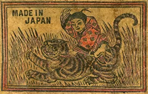 Tiger Gallery: Old Japanese Matchbox label with a man fighting a tiger