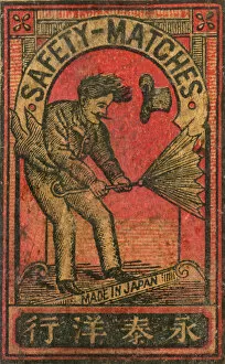 Old Japanese Matchbox label with man with an umbrella