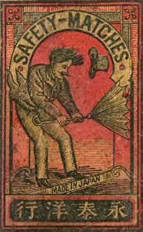 Windy Prints: Old Japanese Matchbox label with man with an umbrella