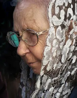 2007 Prints: An old lady wearing a white lace mantilla shawl, Maderia