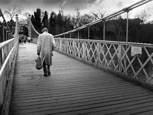 Chester Prints: Old man crosses Queens Park suspension footbridge, Chester