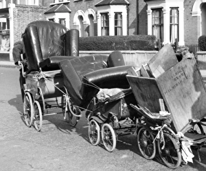 Old man pulling prams, Balham, SW London Old man pulling prams, Balham, SW London