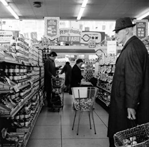 Old man shopping in supermarket, Bristol