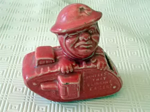 Images Dated 24th May 2006: Old Bill Pink glazed money box in the form of a WW1 tank