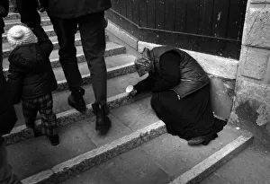 Photography by Philip Dunn Collection: An old woman holds out a cup to beg on a Venice bridge