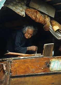 Images Dated 8th August 2019: An old woman on a junk in a typhoon shelter, Hong Kong