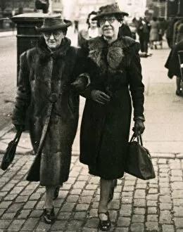 Furs Collection: Old women walking togther down the street, 1920s
