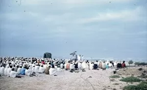 Sultanate Collection: Omani Elders looking towards the sea on a beach in Oman