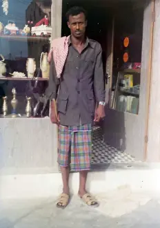 Easterni Prints: Omani man standing in front of a shop in Oman