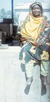 Salalah Prints: Omani market woman sitting on the wall