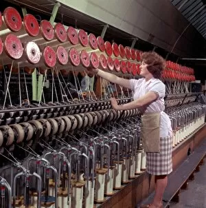 Adjusting Gallery: Operating a wool-winding machine
