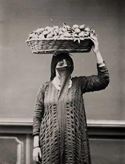 Orange merchant - woman with a basket of fruit Egypt
