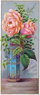 Orange-pink roses in a vase on a Christmas card