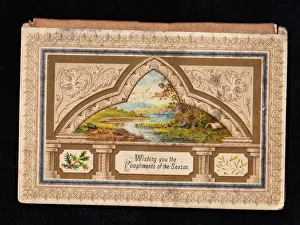 Ornate Christmas card with holly and mistletoe