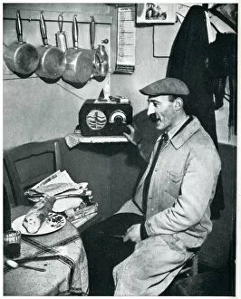 Frenchman Collection: Outbreak of WWII Parisian greengrocer listens to the news