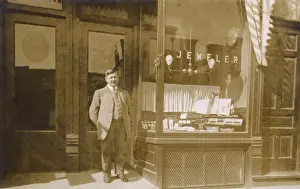 Owner standing outside jewellers shop, USA