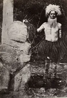 Pacific Islands, Oceania: man with grass skirt, headdress