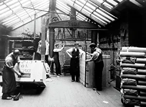 Packing finished cloth in a woollen mill in Bradford