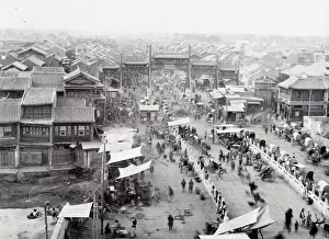 Paifang, pailou, arch and street scene, Peking, Beijing, China