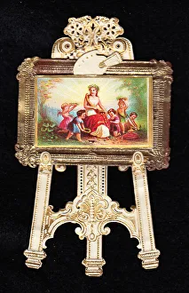 Painting on an easel on a cutout greetings card