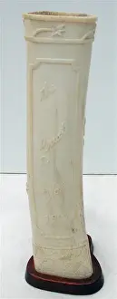 Inscriptions Prints: Pair of carved bone ornaments with raised foliate decoration
