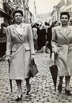 Images Dated 19th May 2017: Pair of French twins strolling downing a cobbled street