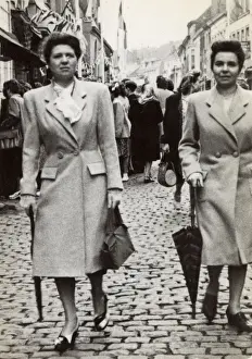 Downing Prints: Pair of French twins strolling downing a cobbled street