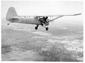 Parachutist Prints: Parachutist preparing to jump from Auster J-1N Alpha G-AIGU
