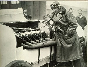 Parry Thomas, racing driver, inspecting 400 hp engine