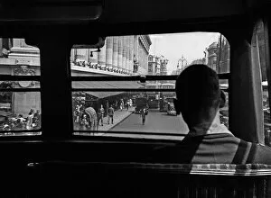 Passenger on bus approaching Harrods store, London
