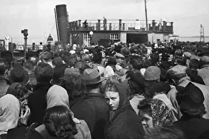 Anxiously Gallery: Passengers about to board a ferry