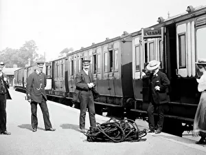Porters Prints: Passengers and porters at an English railway station