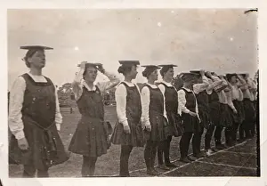 Peace day Sports. Line of students balancing books on heads
