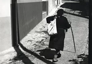 Peasant woman in street, Greece