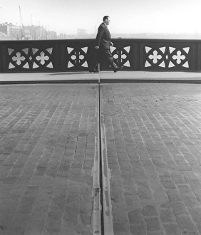 Pedestrian crossing the gap, Tower Bridge, London