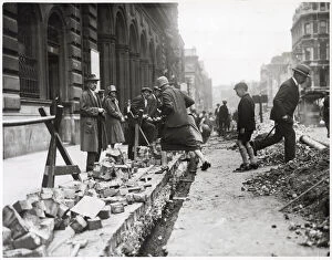 Images Dated 29th January 2021: Pedestrians clamber over street roadworks in Piccadilly in a rather dangerous manner by