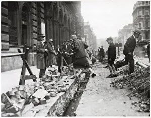 Manner Prints: Pedestrians clamber over street roadworks in Piccadilly in a rather dangerous manner by
