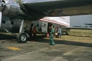 Images Dated 9th August 2012: People boarding a small aeroplane