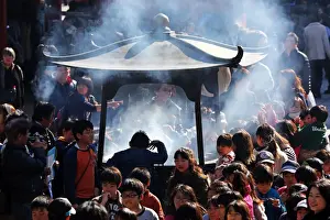 People burning incense at Senso Ji Temple in Asakusa, Tokyo