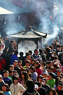 People burning incense at Senso Ji Temple in Asakusa, Tokyo