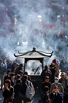 People burning incense at Senso Ji Temple in Asakusa, Tokyo