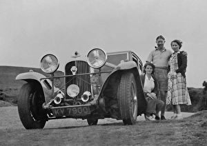 Checked Gallery: Three people with a car