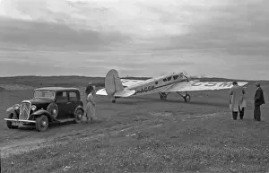Spartan Prints: People with car and light aircraft, Scotland