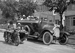 People in charabanc and motorcycle sidecar