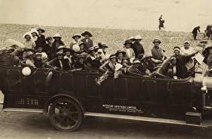 People in a charabanc at the seaside People in a charabanc at the seaside