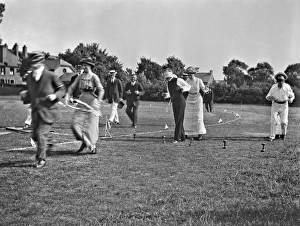 Blindfold Collection: People at a comic sports event in a field