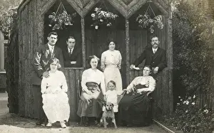 Loggia Prints: Eight people with a dog in a garden