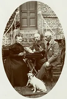 Three people with a dog in a garden